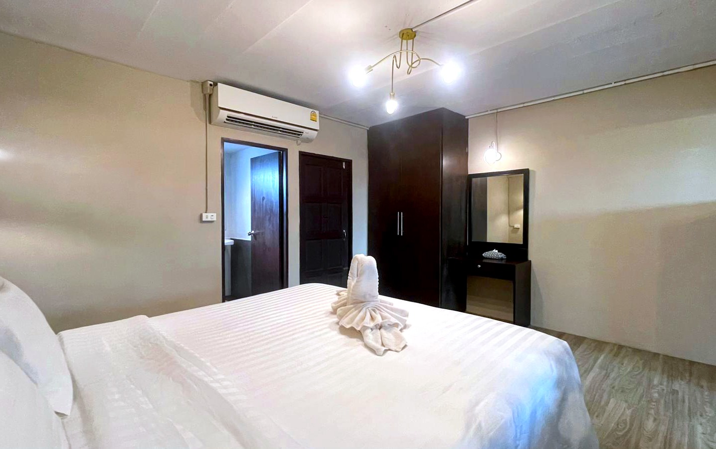 Suite bedroom with wardrobe and private bathroom access